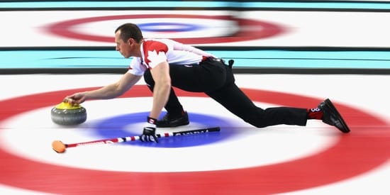 SOCHI, RUSSIA - FEBRUARY 10:  E.J Harnden of Canada in action during the round robin match against Germany during day 3 of the Sochi 2014 Winter Olympics at Ice Cube Curling Center on February 10, 2014 in Sochi, Russia.  (Photo by Clive Mason/Getty Images)